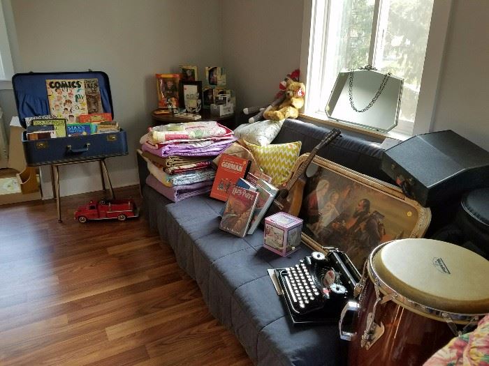 Vintage luggage, blankets, quilts picture, old typewriter in case with manual, Mattel Disney dolls (NEW in box) and Drum with carrying bag