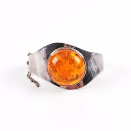 Sterling Silver Bracelet with Reconstituted Amber: A sterling silver bracelet with reconstituted amber.
