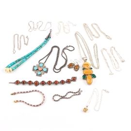 Sterling Silver Jewelry with Turquoise and Coral Accents: A collection of sterling silver jewelry with turquoise and coral accents. This collection includes nine necklaces, three bracelets, and one pair of earrings. They are adorned with turquoise, coral (dyed and undyed), synthetic ruby, cubic zirconia, and treated quartz.