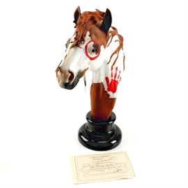 Carlos Estevez Limited Edition "Blizzard" Horse Head Statue: A Carlos Estevez “Blizzard” horse head statue. This resin figurine depicts the head of a paint horse, with a red circle around one eye and hand print on the neck, and feathers tied to the mane. The head rests on a black marble base with the horse’s and artist’s names recorded on a plaque. The back is also double-signed, along with the edition number 53 of 150. Also included is a Certificate of Authenticity.