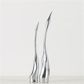 Pair of Hoselton Studio Metal Alloy Crane Sculptures: A pair of metal alloy crane sculptures from the Waterfowl collection by Hoselton Studio. Features are two abstract cranes rendered with long necks and beaks in the air. A numeric inscription is present to the bottom of each. Both are marked “Hoselton/ Canada” on the bottom as well.