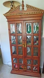Contemporary lighted curio cabinet with bubble glass panes