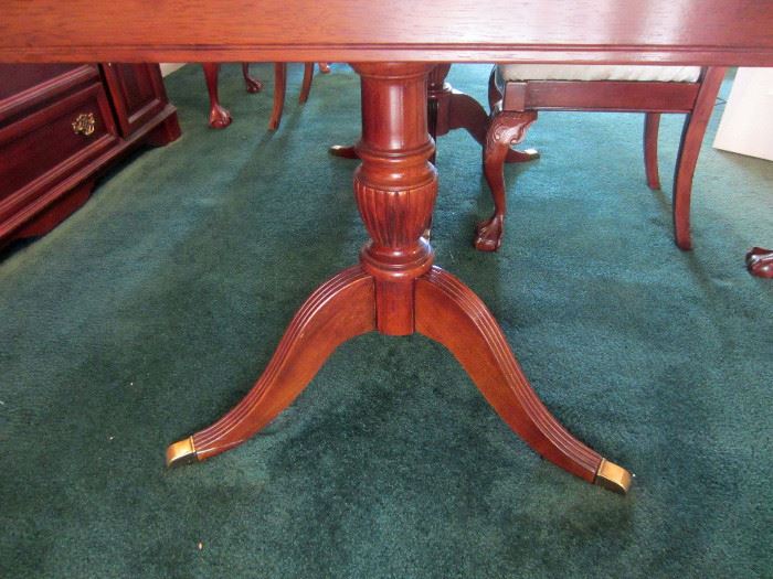 Twin pedestal base table with leaf