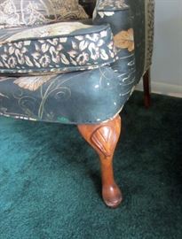 Front leg of wing-back chair
