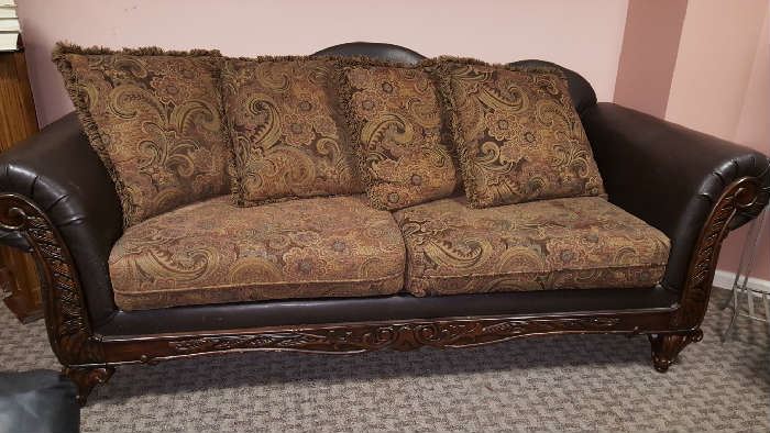mix media sofa of leather, wood upholstery