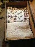 Beautiful solid cedar chest with lots of hand made quilts to choose from.