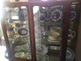 Large china cabinet with many collectible chine plates to choose from, all different eras and styles to fit any collector!