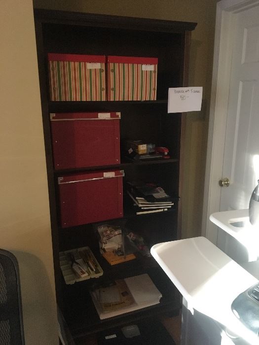 Bookshelf with storage boxes and office supplies