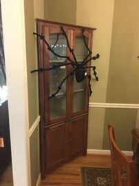 Corner hutch with glass doors and awesome Halloween spider decoration