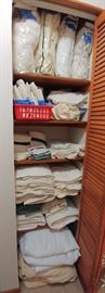Linen closet FULL of near new condition towels, wash cloths, sheet sets, blankets, comforters, etc.   HALL  