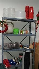shelving unit with Tupperware, Thermos, vases, weights, etc.     GARAGE