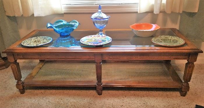 coffee table with glass top and cane bottom