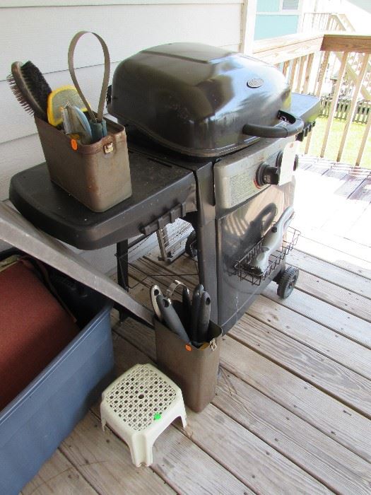 Gas grill, dog grooming items, BBQ tools