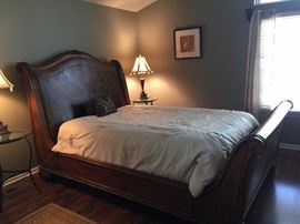 Exquisite Henredon queen-size sleigh bed. Leather headboard.