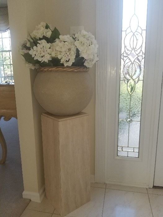 gorgeous pedestal and ceramic pot of flowers 