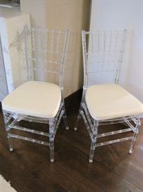 Lucite Chairs.