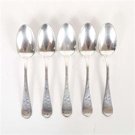 Towle "Lily" Sterling Silver Teaspoons: A pair of sterling silver spoons by Towle Silversmiths, in their Lily pattern. The matching spoons feature teardrop handles ornamented with a delicate incised foliate design. The total approximate weight is 4.020 ozt.