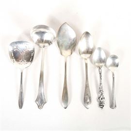 Assorted Sterling Silver Flatware Pieces: A collection of sterling silver flatware pieces. The pieces are made of sterling silver. The collection includes a Lunt Mount Vernon demitasse spoon, a Reed & Barton Les Six Fleurs demitasse, a Webster short handle chocolate spoon, a Gorham Old English Tipt solid jelly server, and a Wallace bon-bon spoon and solid gravy ladle. The combined weight for all pieces is 3.45 ozt.