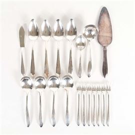 Oneida Community Plate "Patrician" Flatware: A collection of silver plate flatware by Oneida. This nineteen piece group includes a pie server, four gumbo spoons, sugar shell, gravy ladle, six cocktail forks, a seafood fork, four serving spoons, and a master butter knife. These pieces feature the Patrician pattern and each is marked “Community Plate."