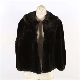 Vintage Sheared Mink Cape by Edwards Fur Shop: A vintage sheared mink cape. The vintage cape is made of dark brown sheared mink fur and was by Edwards Fur Shop as indicated by the attached label. The cape features a patterned satin lining.