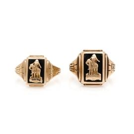 10K Yellow Gold Class Rings: A pairing of 10K yellow gold rings. These rings are class rings which feature a school symbol attached to an inlaid black enamel plaque with textured dated shoulders. Both of the rings have “Quincy” and the year embossed to the crown and shoulders, and both rings have engraved monograms to the interior shank.