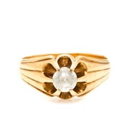 14K Yellow Gold White Sapphire Ring: A 14K yellow gold white sapphire ring. This ring features a prong set stylized crown with a flower motif with ridged shoulders.

A 14K yellow gold white sapphire ring. This ring features a prong set stylized crown with a flower motif with ridged shoulders.