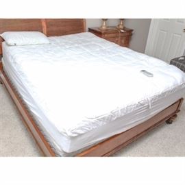 Sleep Number "Innovation" Queen Size Mattress and Base: A Sleep Number Innovation series queen size mattress and base. This mattress can be inflated to suit a wide range of firmness or softness preferences via the included digital remote. The base below is assembled from hollow pieces of molded plastic, and a white pillow top over is also included with two medium-firm down alternative support pillows.