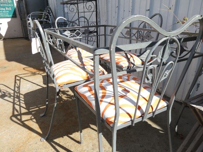 Vintage, very old Salterini dining set includes rectangular table with 4 chairs and new cushions. No glass and in vintage condition.  Good strong set.