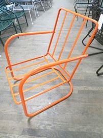 Vintage metal spring chair restored in a powder coated melon finish.  Great condition