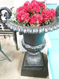 Vintage cast iron garden urn in 2 pieces.  Slight tilt and restored in powder coated jet black.