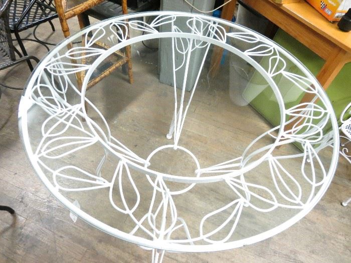Vintage hand wrought iron dining table powder coated in a pure white finish.  Very rare.  Glass has a couple of small chips.