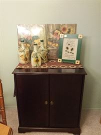 television/storage cabinet.  Sunflowers