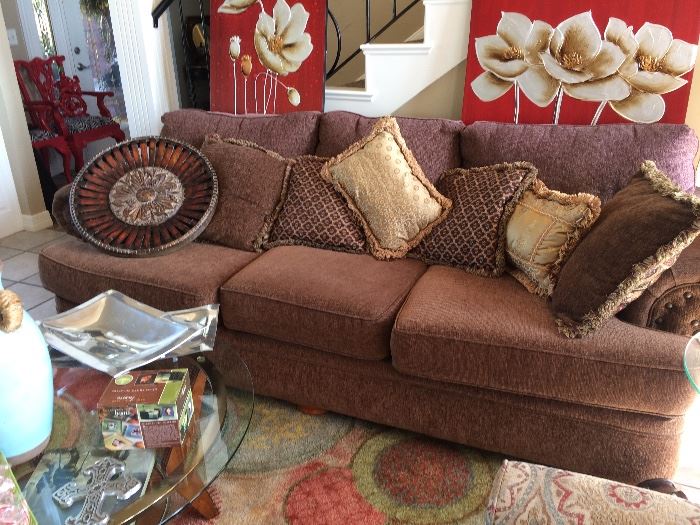 Comfy and classic sofa!  Pillows, rug and tables. 