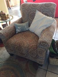 Overstuffed chair and coordinating rug