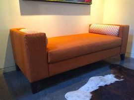 Custom Orange Fabric Bench with Bolster Pillows.