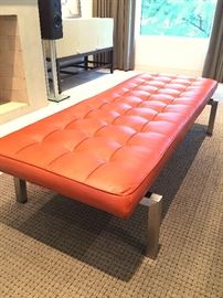 Rex tufted leather bench with brush nickle base.