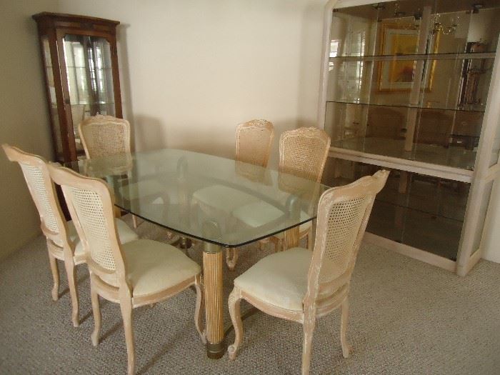 Beautiful glass table and 6 chairs, can be sold seprately.  Hutch/Display case matches bleached wood  and can be make the set or sold individually. 
