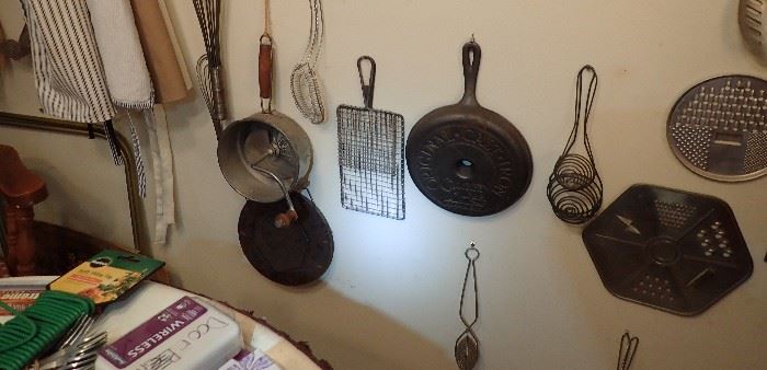 VINTAGE GADGETS THERE ARE WALL FULL OF OLD COOKING UTENSILS