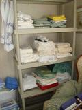 Tons of linens, rugs, draperies, tablecloths, towels, etc.