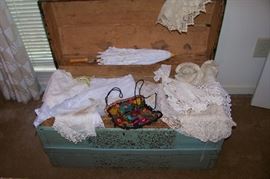 Beautiful antique linens in an antique trunk