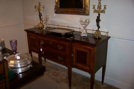 Beautiful mahogany sideboard with brass gallery - banding on top as well as on drawers with brass casters on legs
