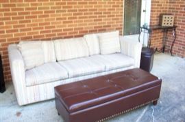Leather storage bench with brass studs