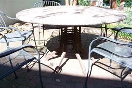 Iron and granite top patio table and 6 chairs