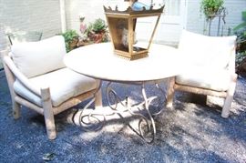 Iron base table - pair of chairs - on the back patio