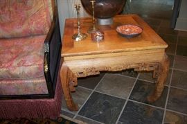 One of a pair of teak tables