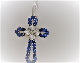 18K white gold sapphire and diamond cross.  .12 ct diamonds - .50 sapphire