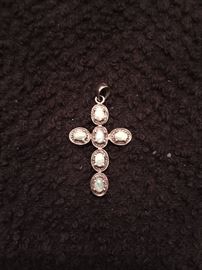 Small gold cross with opal stones