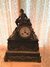 Antique bronze and marble clock with silk treat suspension.