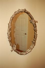 Heavy ornate oval mirror
