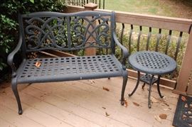 Black aluminum love seat and round bistro table